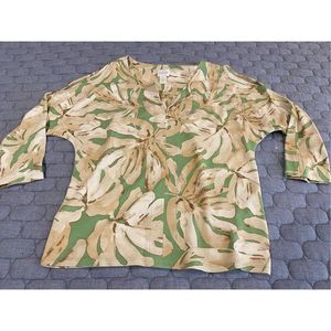 New without tags.  Ladies cold shoulder top by Chicos.  Size 0